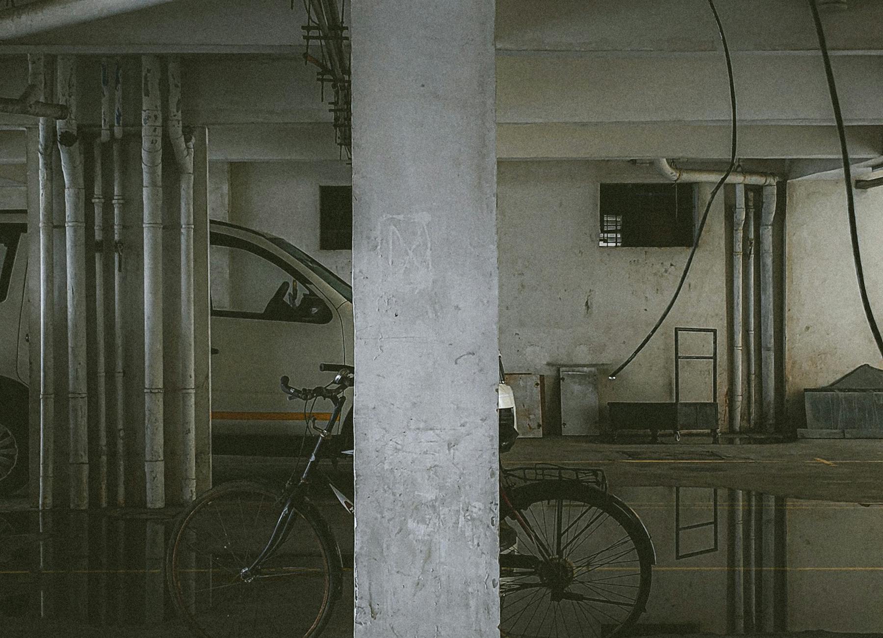 Flooded basement car park with standing water across the floor
